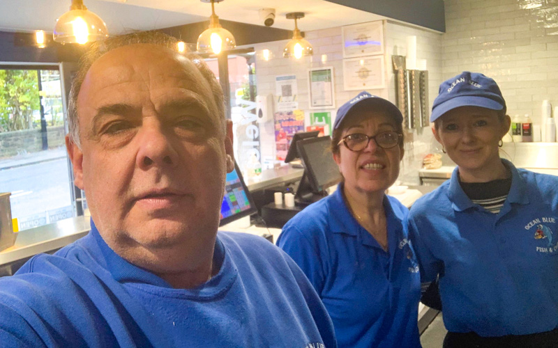 A group photo of Pavlina and staff at the Ocean Blue fish and chip shop
