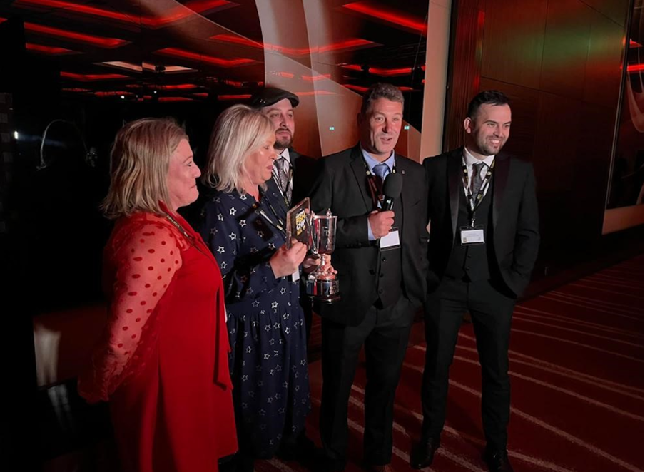 An image of the National Fish and Chip awards showing the winners being interviewed with their award.