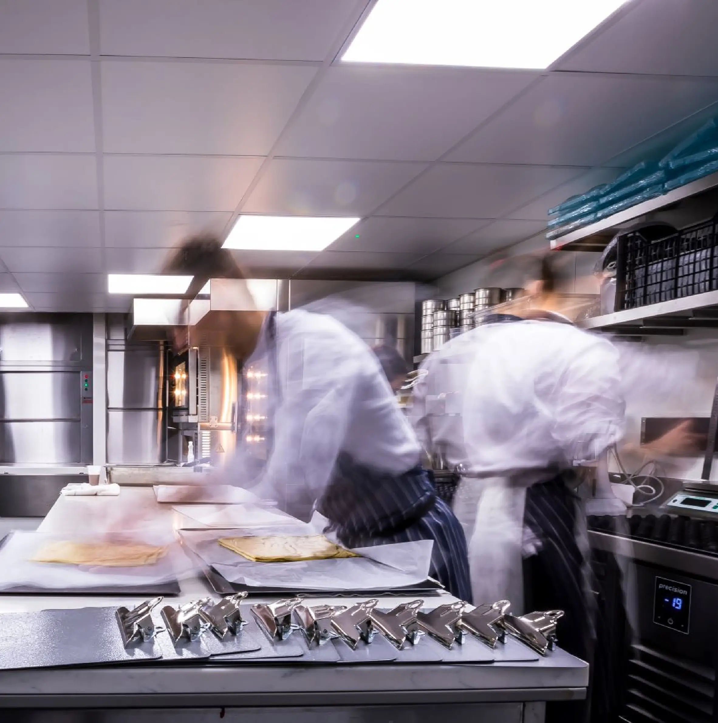 Chef moving in kitchen creating blurry picture