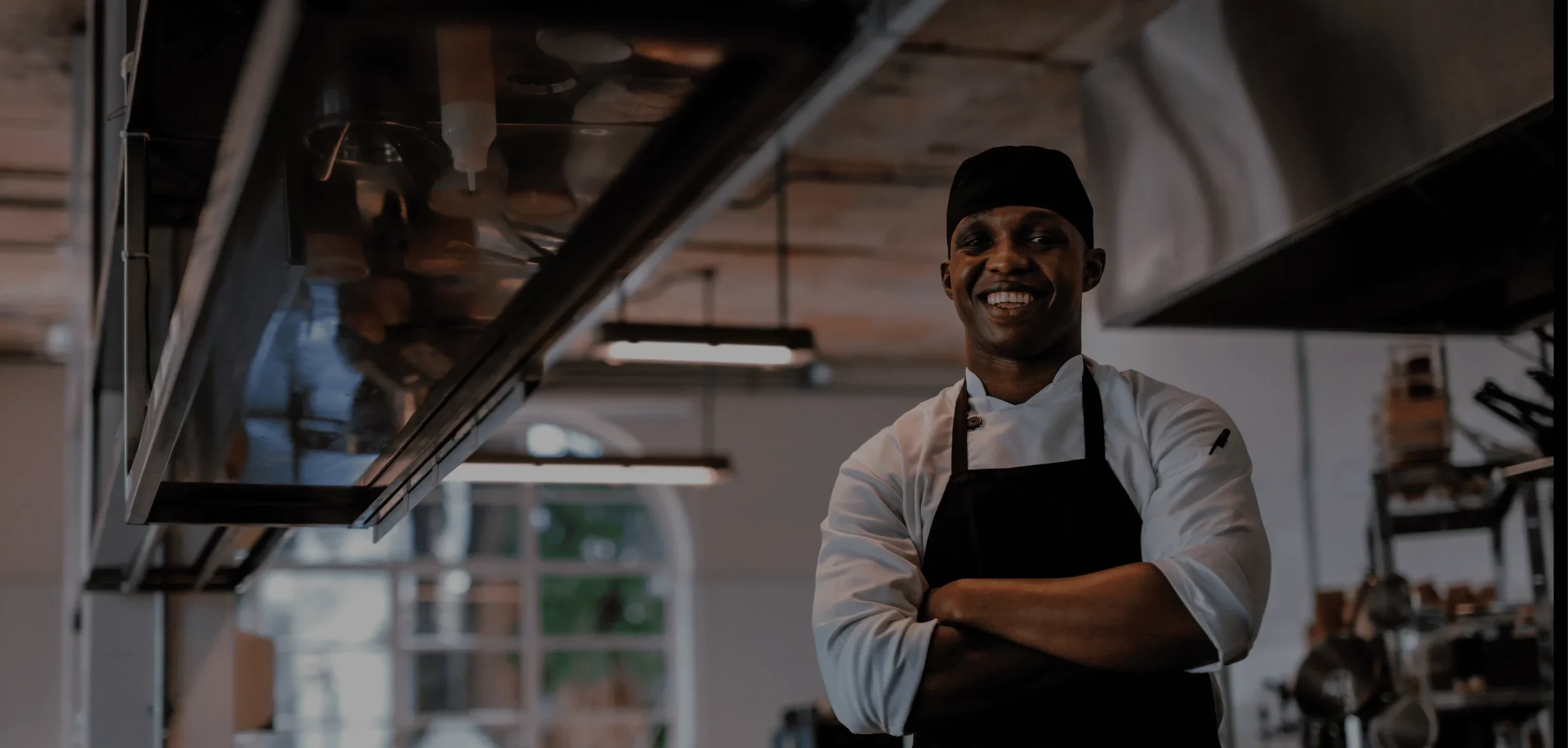 Chef in his apron smiling at the camera