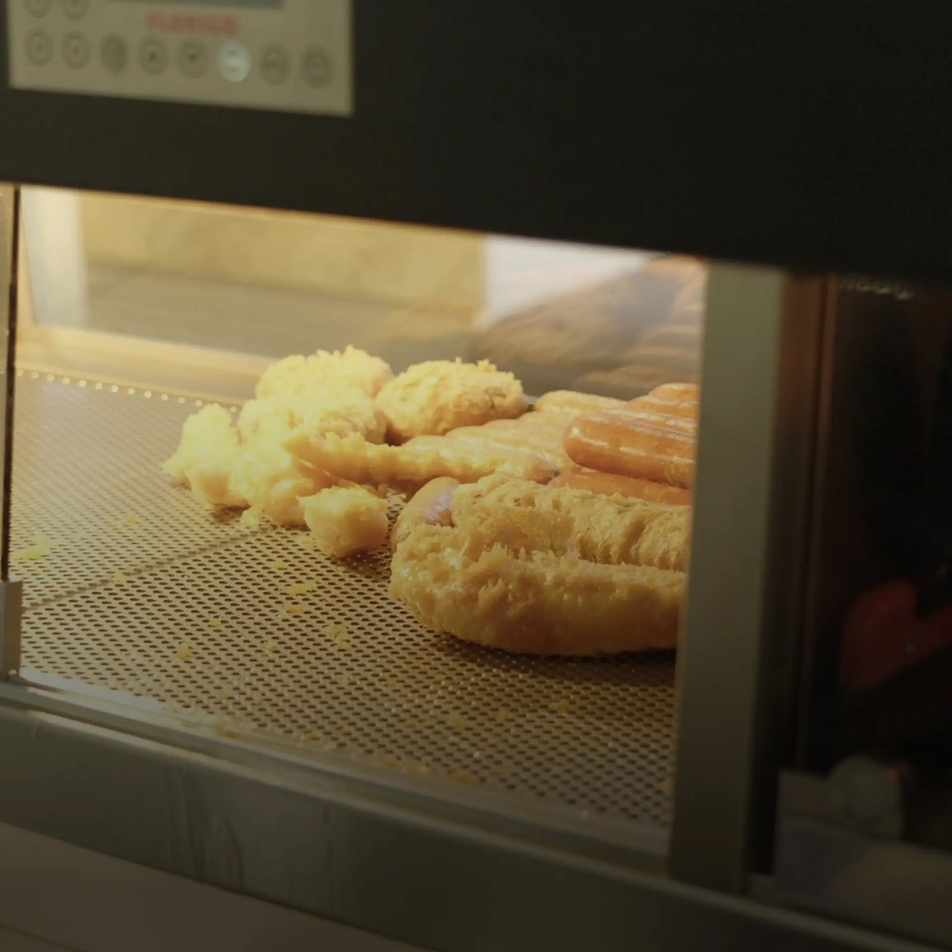 Fish and sausages pictured in warm food counter