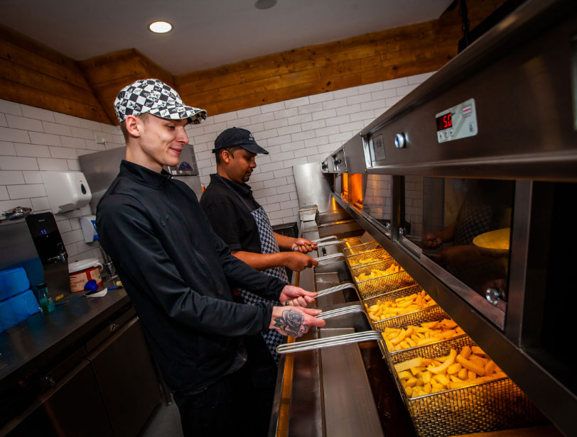 Chefs frying chips