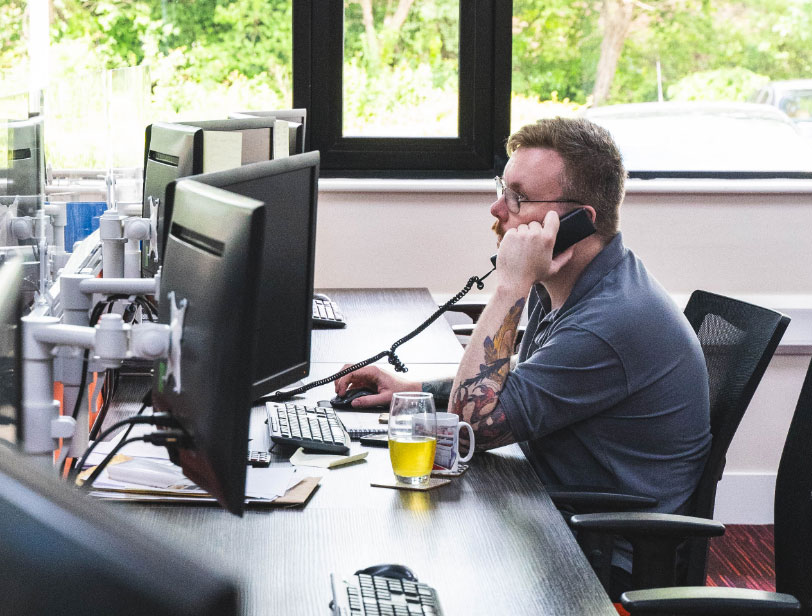 Man pictured tending to the support line in office